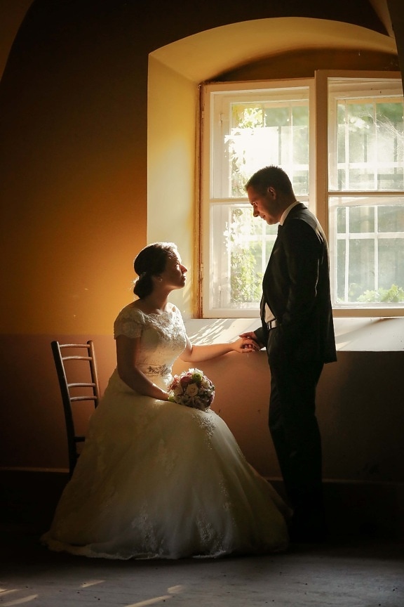 groom, chair, sitting, bride, window, dress, bouquet, love, wedding, couple