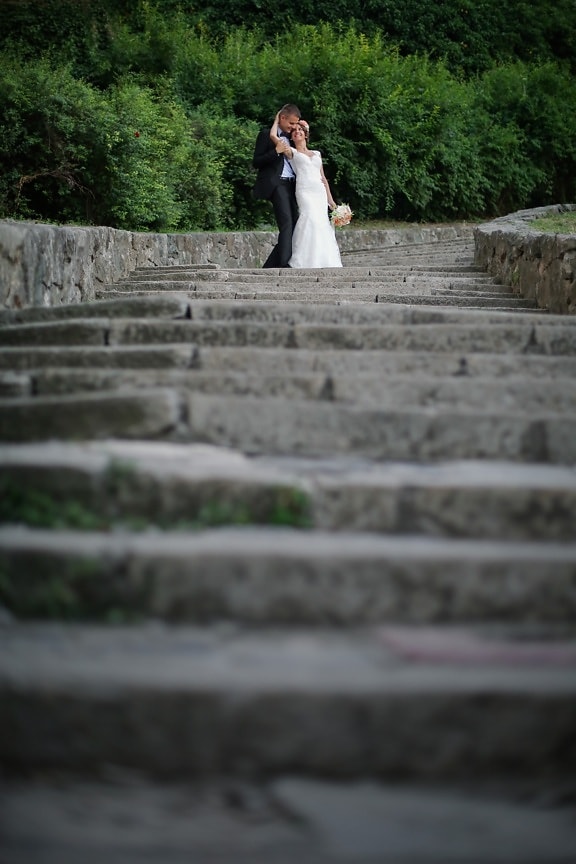 bride, embrace, groom, hug, stairs, maze, architecture, stone, history, old