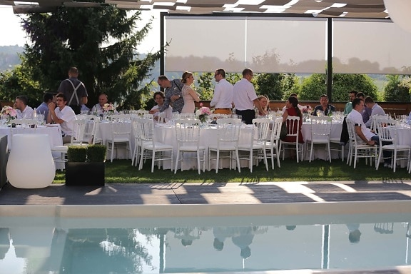 party, swimming pool, ceremony, bartender, meeting, table, dining, patio, structure, restaurant