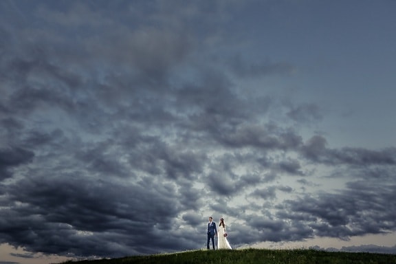 bride, bad weather, hilltop, groom, storm, togetherness, dramatic, spectacular, sunset, nature