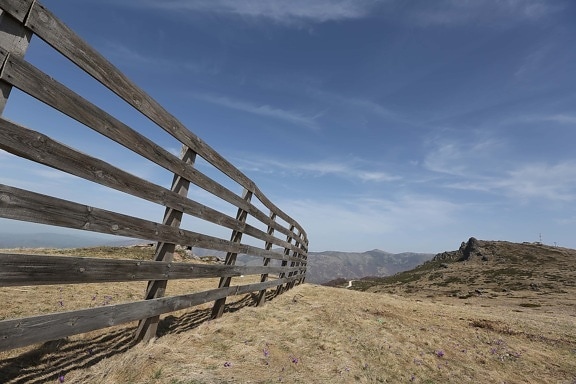 fence, fence line, border, mountain peak, mountainside, hillside, barrier, landscape, scenic, clouds