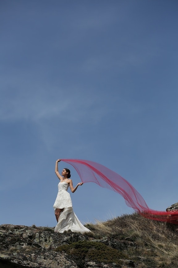 young woman, bride, veil, red, wind, mountain peak, summer, grass, fun, field