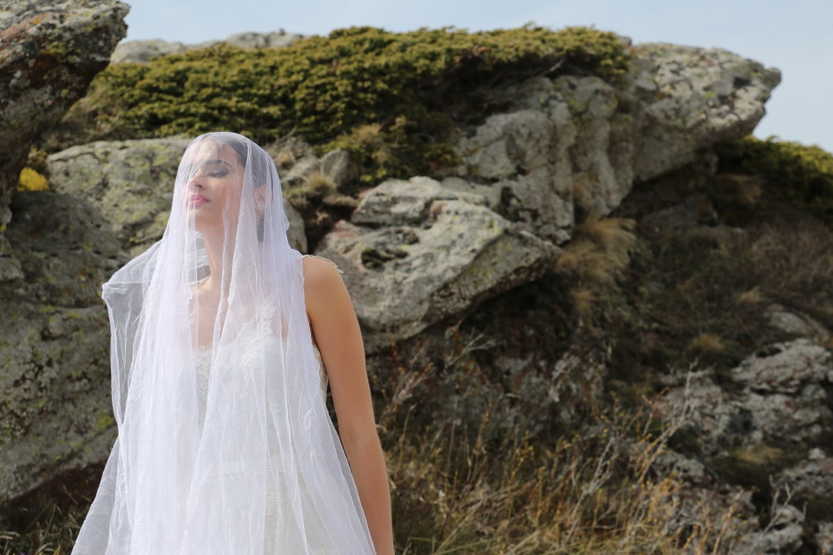 bride, young woman, veil, mountainside, posing, portrait, wilderness, white, wedding, outdoors