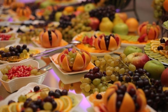 buffet, grapes, fruit, salad bar, oranges, citrus, pomegranate, apples, mandarin, delicious