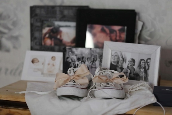 footwear, frame, shoelace, picture, sneakers, photograph, people, furniture, indoors, room