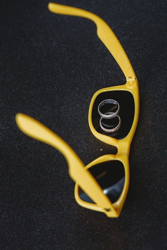 yellow, plastic, sunglasses, wedding ring, rings, fashion, still life, indoors, black, object