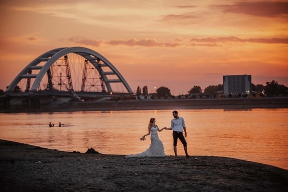 wedding dress, beach, sunset, groom, bride, water, structure, sea, bridge, dawn