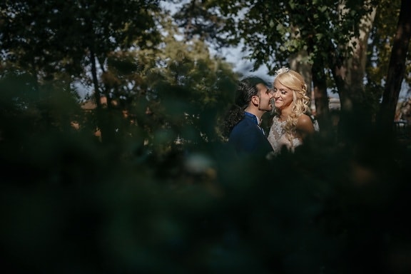 newlyweds, kiss, girl, groom, woman, blur, man, portrait, outdoors, wedding