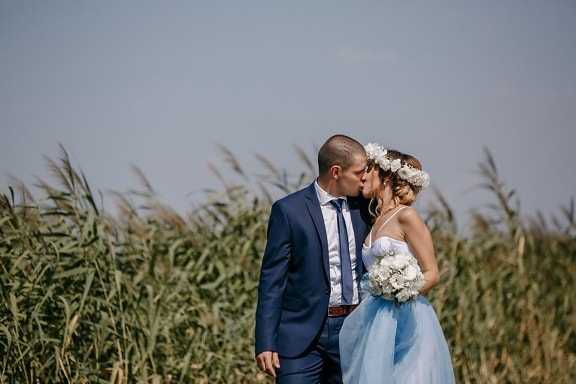 newlyweds, outdoor, kiss, agriculture, field, groom, love, wedding, couple, nature