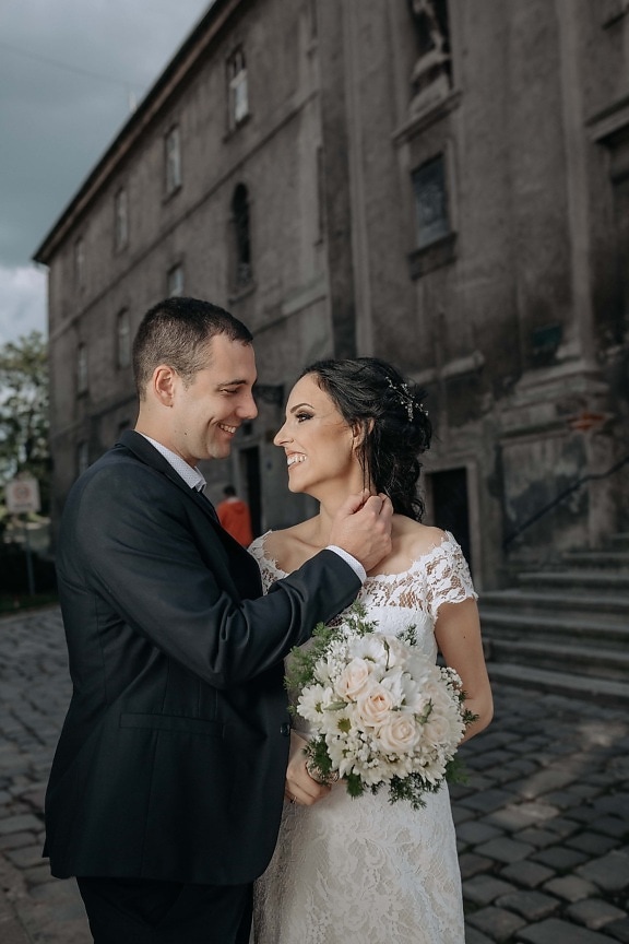 just married, hugging, smiling, architectural style, street, wedding, groom, bride, couple, man