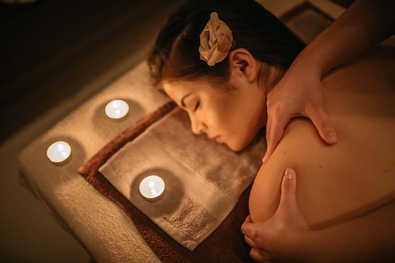 spa center, pretty girl, intimate, shoulder, massage, relaxation, candles, candlelight, lying, woman