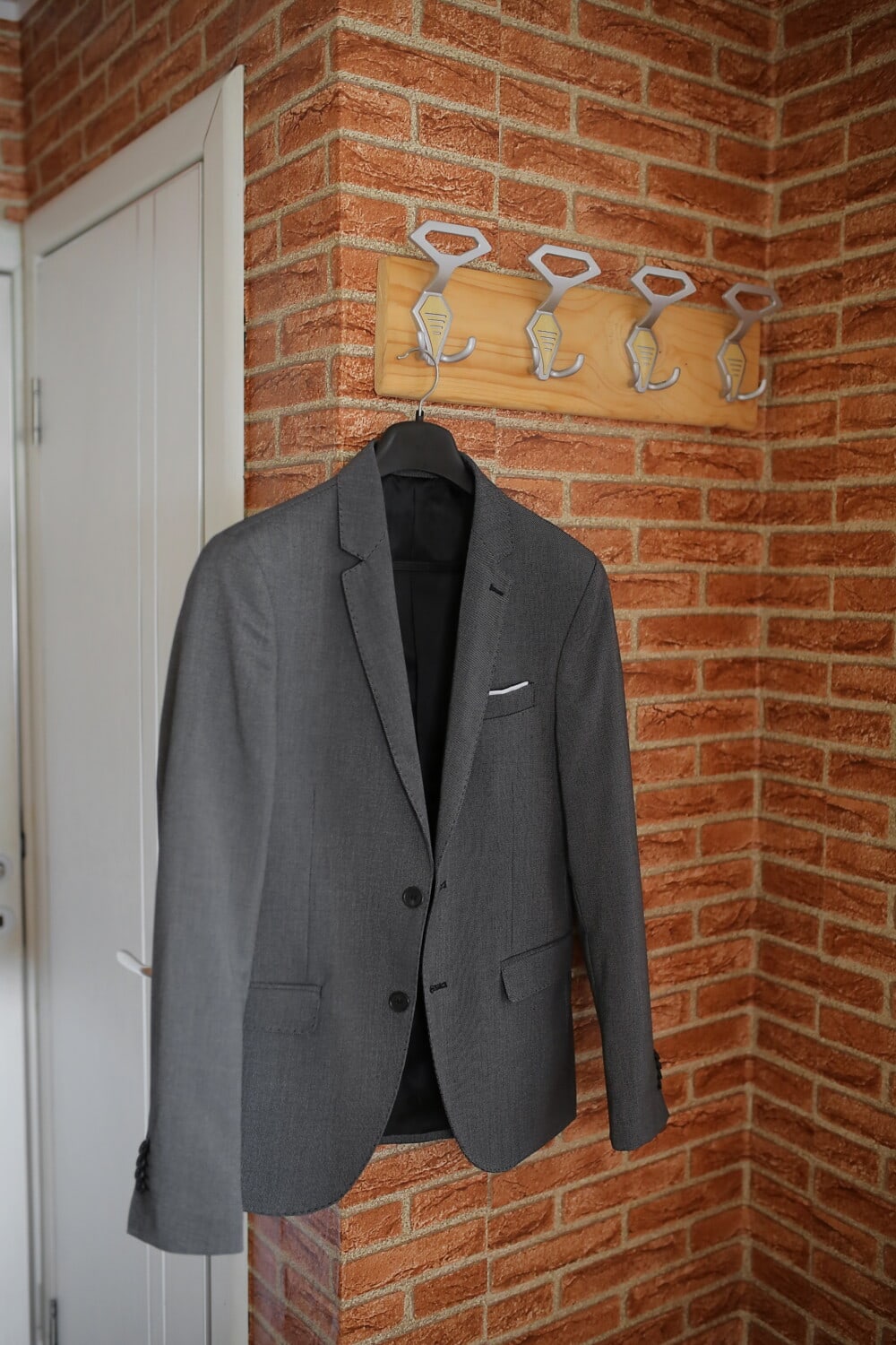 suit, hanging, jacket, covering, garment, clothing, fashion, retro, urban, brick