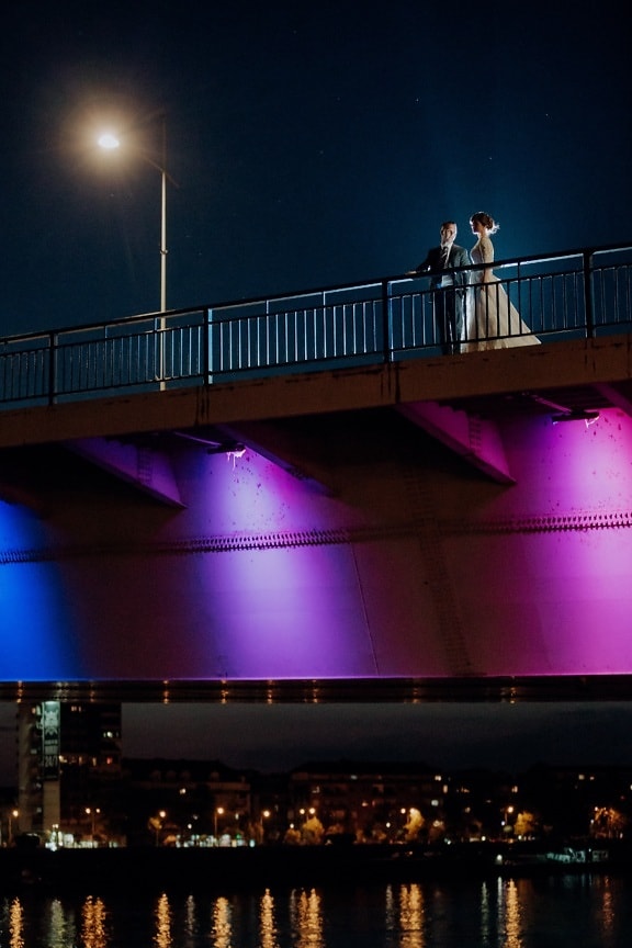 romantic, bridge, night, love date, man, young woman, lights, light, city, water