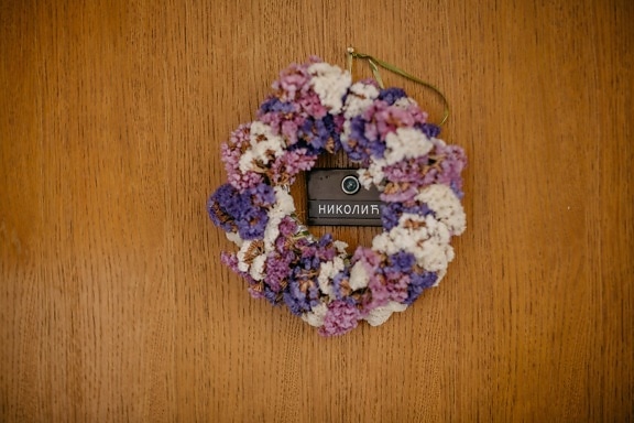 front door, flower wreath, family last name, sign, address, text, front door, wood