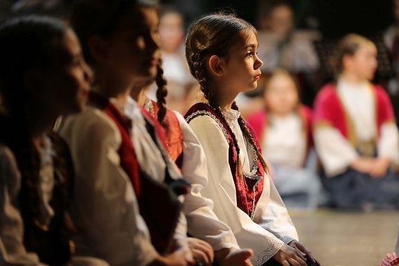 school child, girls, pretty, side view, sitting, concert, people, person, religion, group