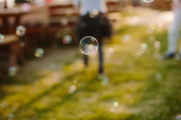 bauble, ear, levitation, round, sphere, flying, shining, reflection, focus, blur