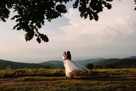 young woman, man, romantic, love, love date, countryside, hiking, hilltop, bride, wedding
