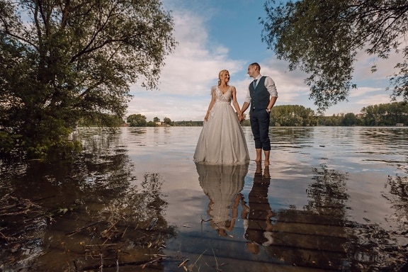 just married, standing, lake, barefoot, passion, love date, affection, smiling, bride, girl