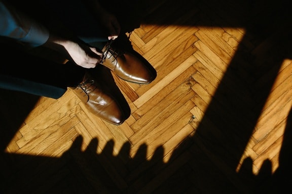hands, shadow, shoelace, shoes, light brown, parquet, floor, hardwood, pants, tuxedo suit