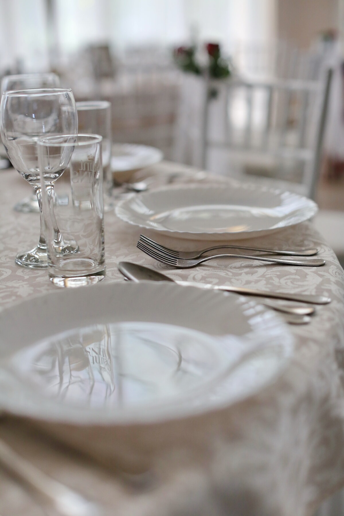 silverware, cutlery, spoon, fork, knife, table, tablecloth, dining area, lunchroom, glass