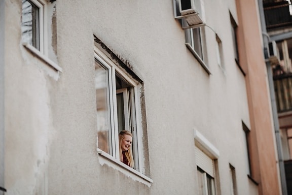 blonde hair, young woman, looking, window, facade, building, architecture, street, house, city
