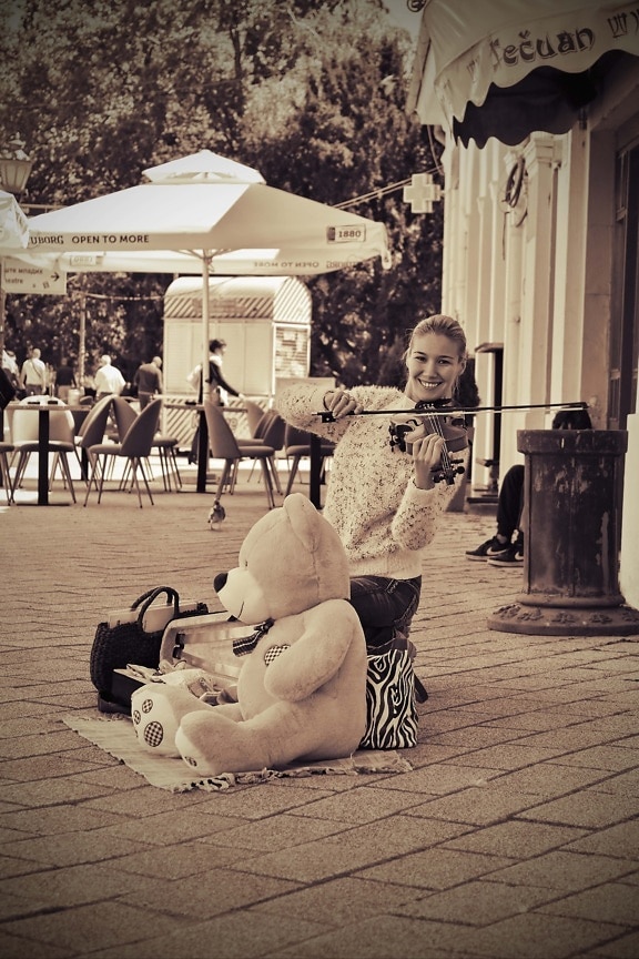 violin, young woman, pretty girl, teddy bear toy, artist, street, smiling, nostalgia, happiness, music