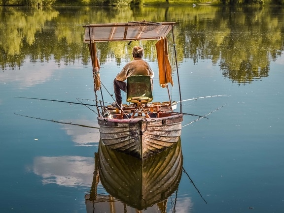 fishing gear, fishing rod, old man, fishing, fishing boat, sunshine, summer season, fisherman, water, reflection