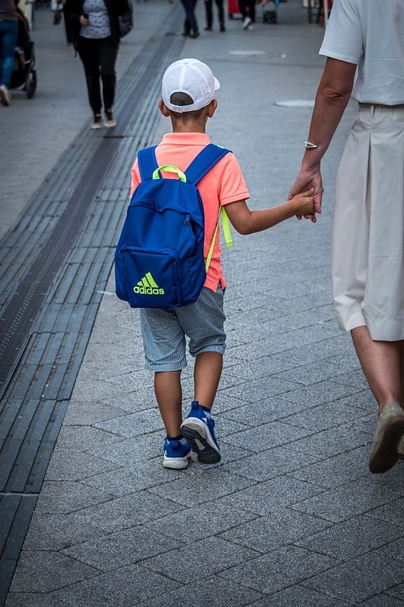 school child, school day, holding hands, mother, son, walking, urban area, street, people, child
