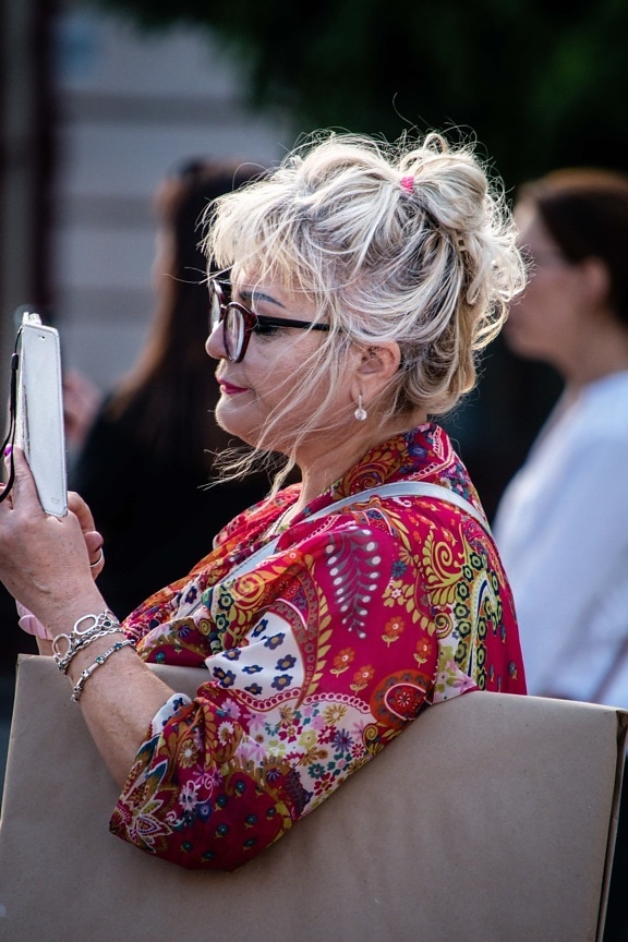 businesswoman, blonde hair, eyeglasses, mobile phone, holding, woman, festival, girl, portrait, street