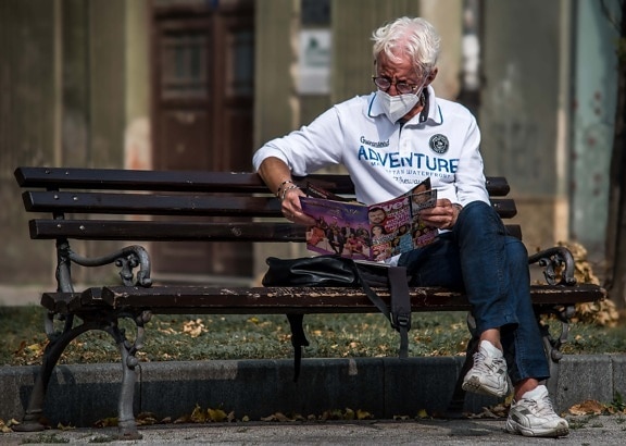social distance, COVID-19, face mask, newspaper, outdoor, man, seat, street, furniture, bench