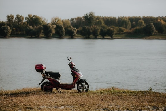 moped, motorcycle, riverbank, minibike, landscape, water, vehicle, river, outdoors, outdoor