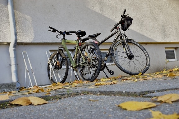 bicycle, parking lot, mountain bike, urban area, yellow leaves, pavement, bike, cycle, wheel, street