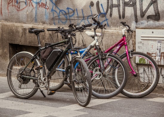 bicycle, parking lot, street, urban area, pavement, electric, mountain bike, device, wheel, vehicle