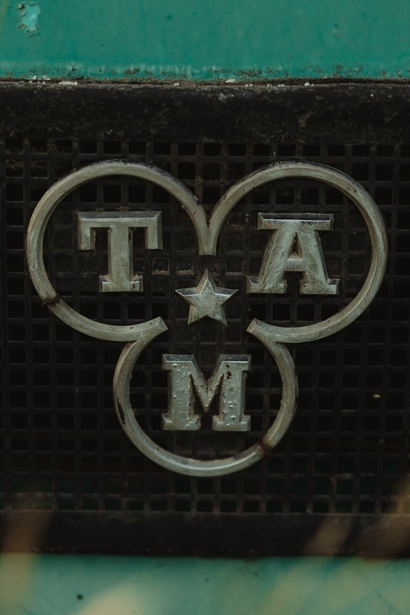 TAM truck sign, star, alphabet, chrome, stainless steel, rust, grid, old, retro, design