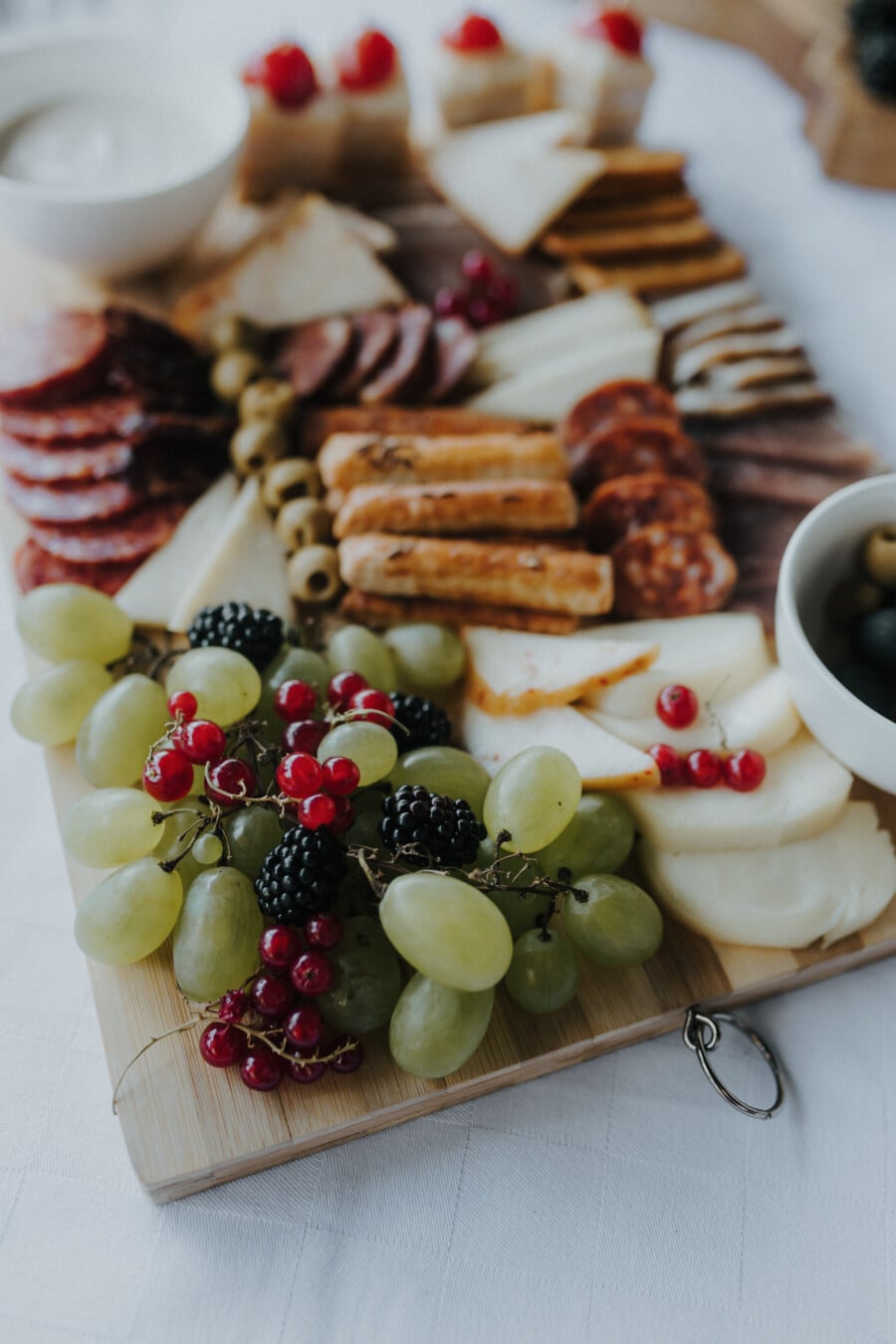 grapes, blackberry, cheese, snack, appetizer, breakfast, currant, olive, sausage, pork