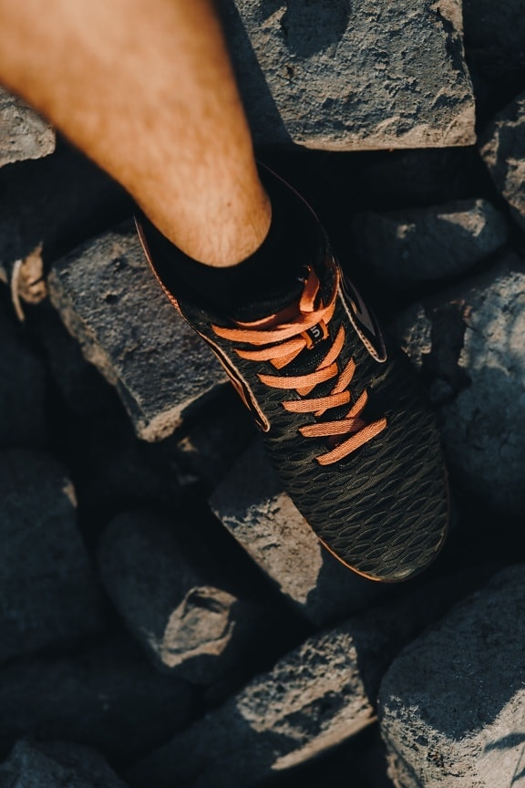 sneakers, black, orange yellow, shoelace, leg, foot, footwear, fashion, man, rocks