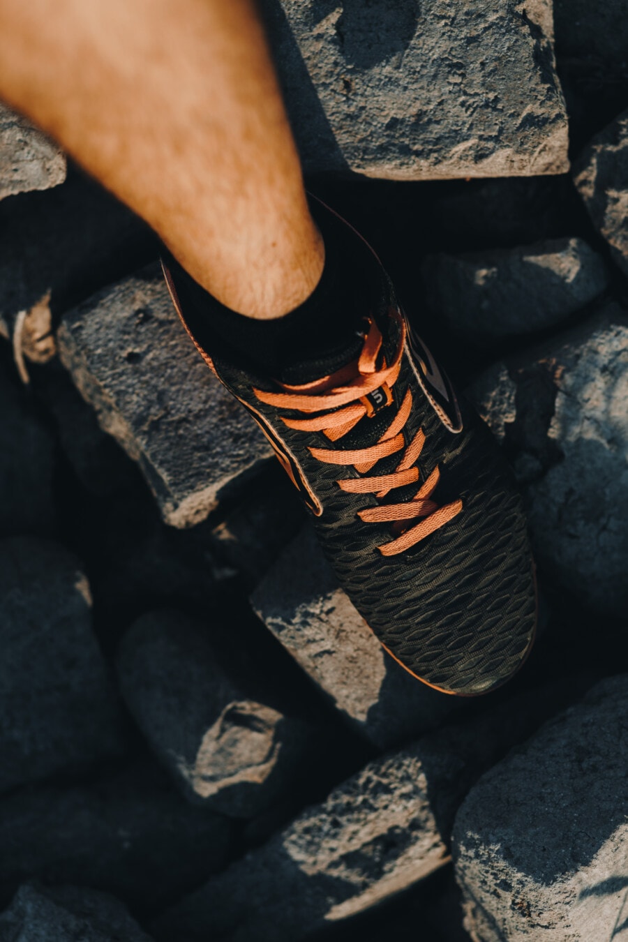 sneakers, black, orange yellow, shoelace, leg, foot, footwear, fashion, man, rocks