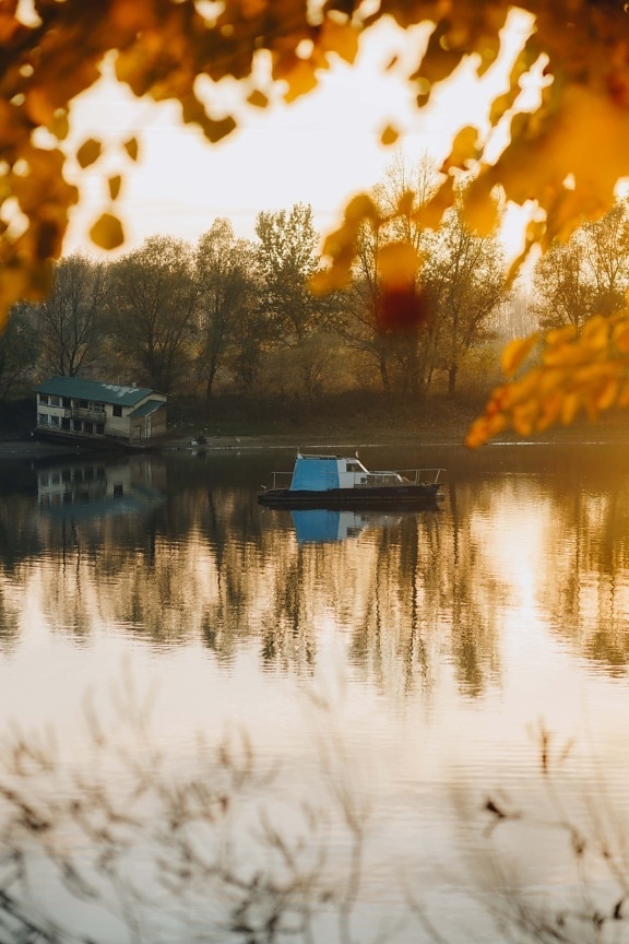 small, fishing boat, boathouse, abandoned, autumn season, placid, tree, water, lake, sun