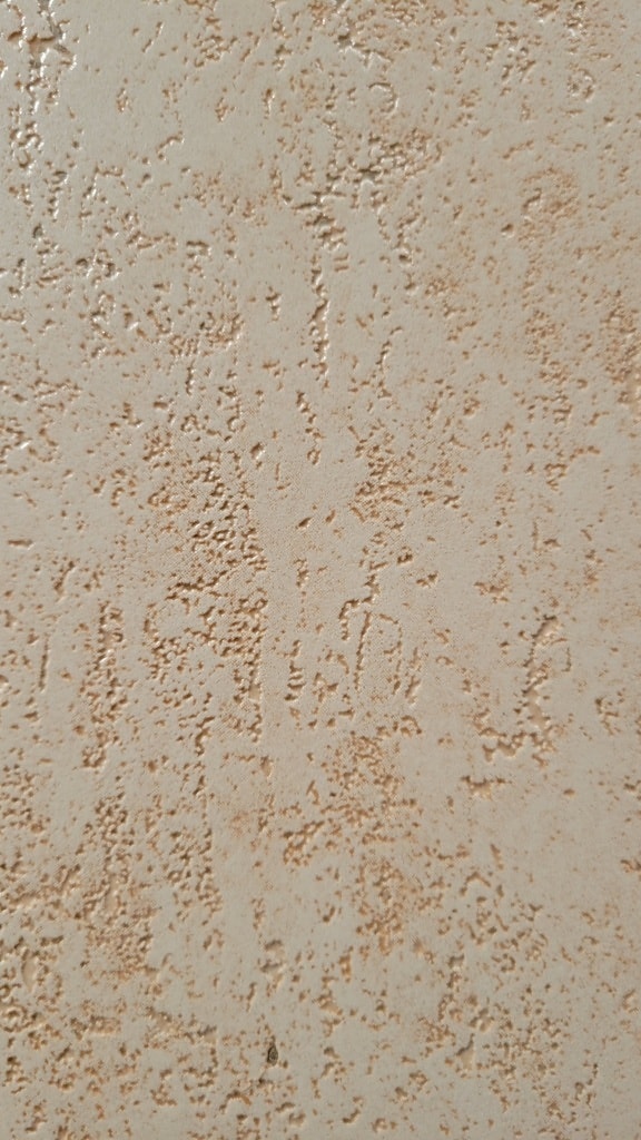 Bahan dinding close-up tekstur semen kuning oranye kasar