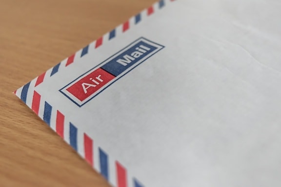 Close-up of white envelope with focus on air mail text
