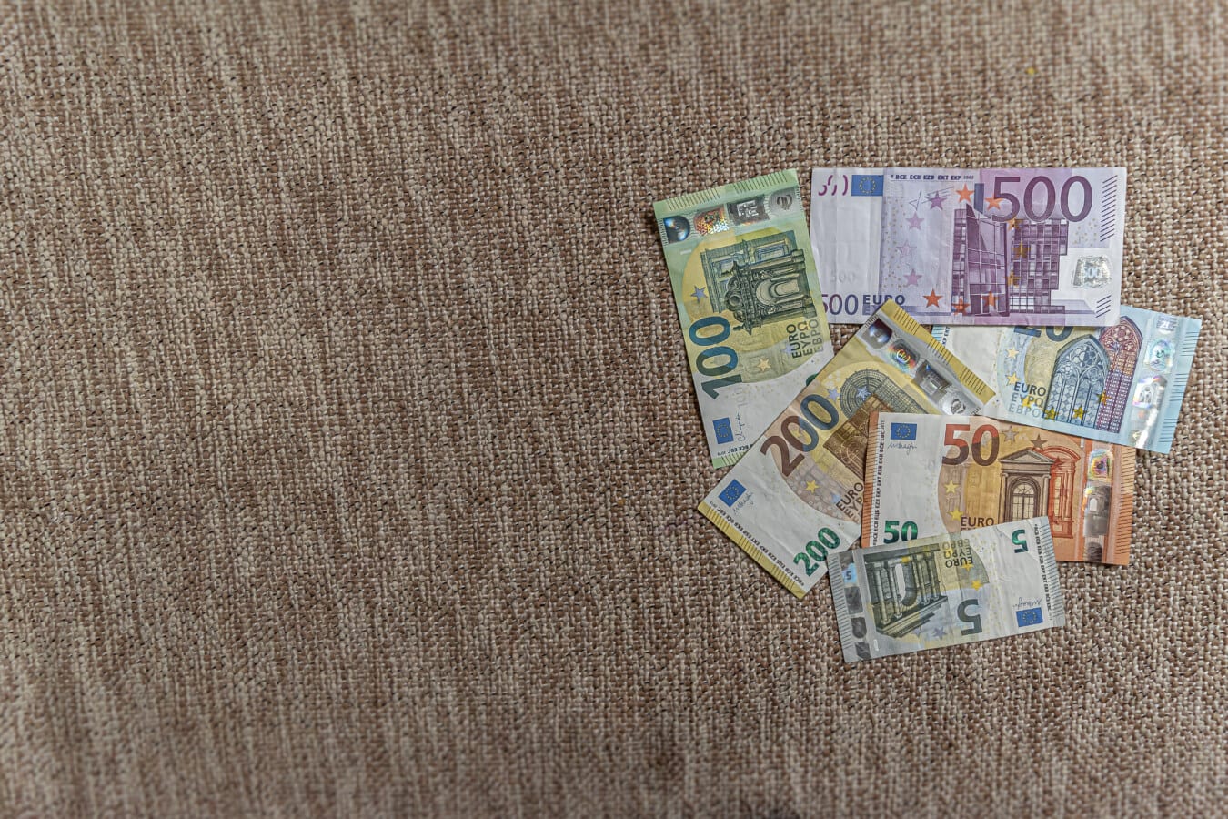 Pile of euro (€) paper banknotes illustrating economy growth