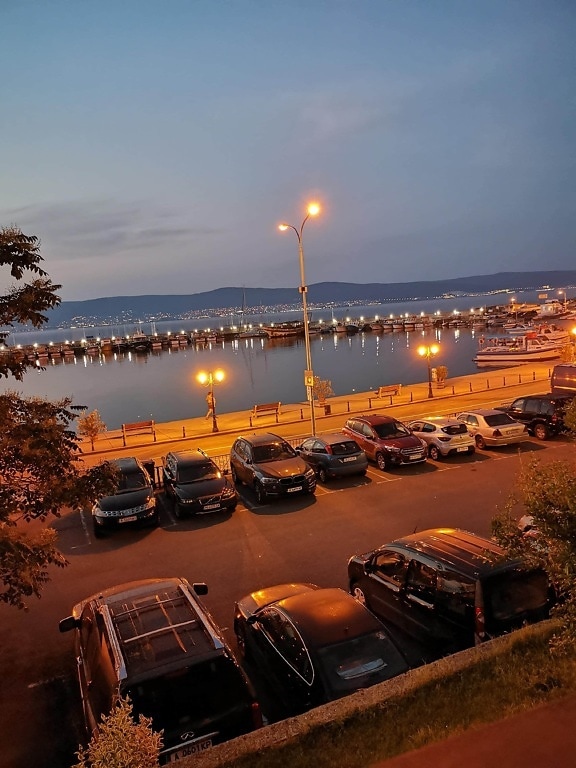 cars, parking lot, harbor, night, street, waterfront, seaside, architecture