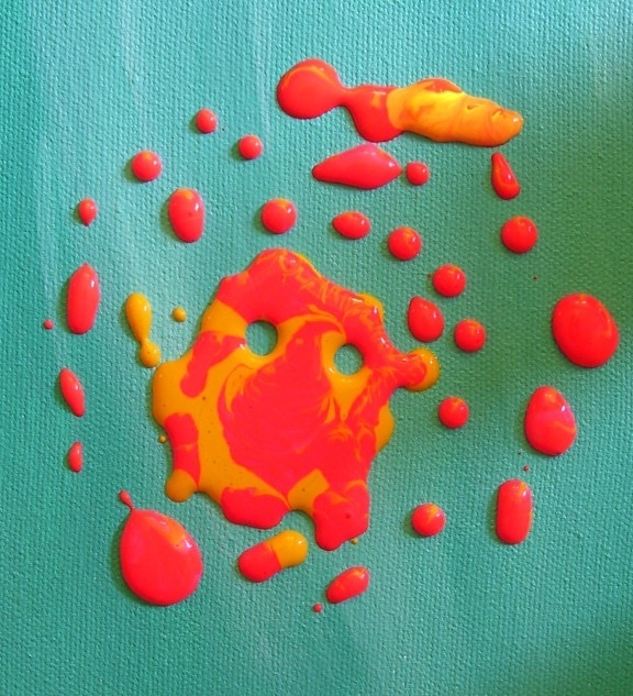 Colorful orange yellow, droplets of acrylic paint