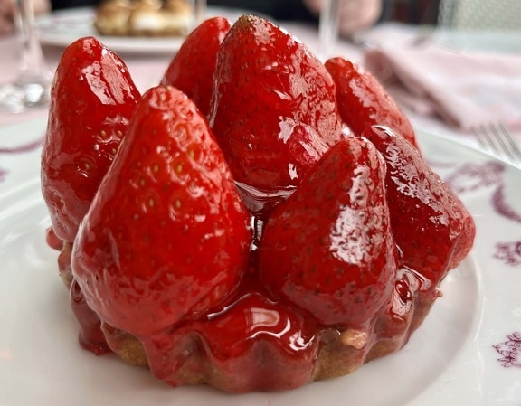 Sweet strawberry custard tart close up