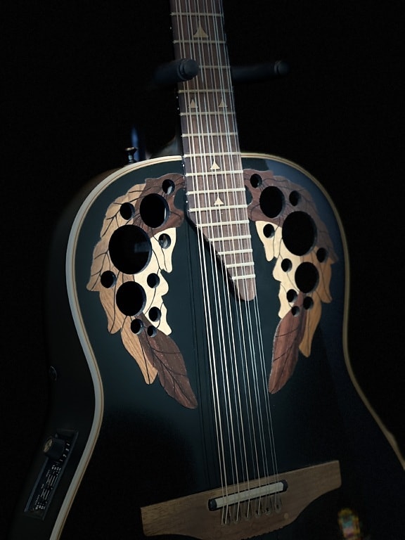 Ovation Elite 1758 electric acoustic guitar in dark