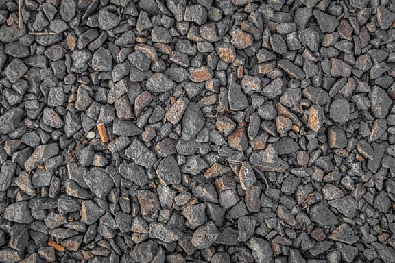 Small grey granite stone pebbles texture