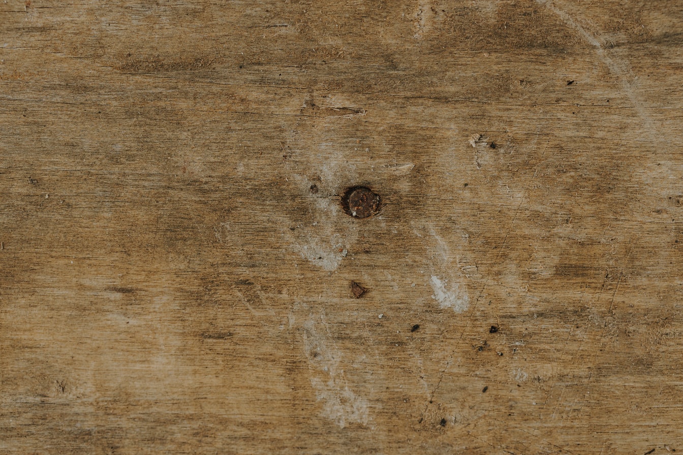 浅棕色尘土飞扬的木板，有结的纹理