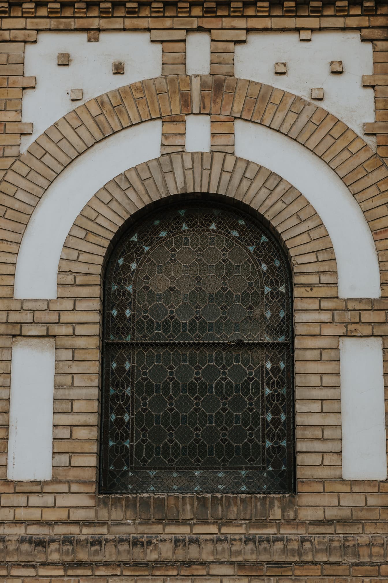 Beautiful synagogue brick wall with stained glass window