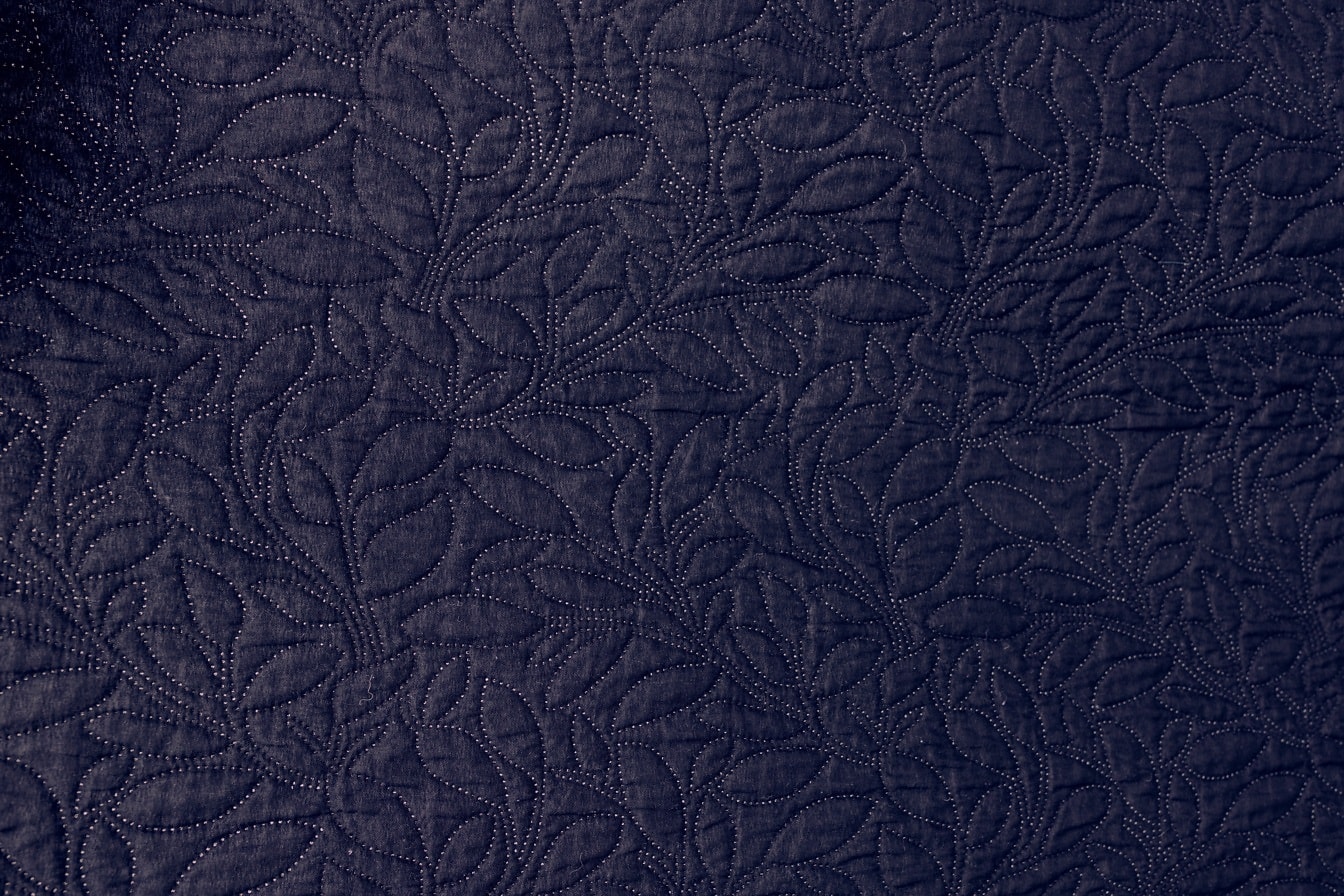 Dark purple cotton textile with ornamental damask texture