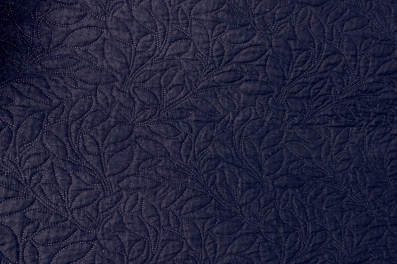 Dark purple cotton textile with ornamental damask texture